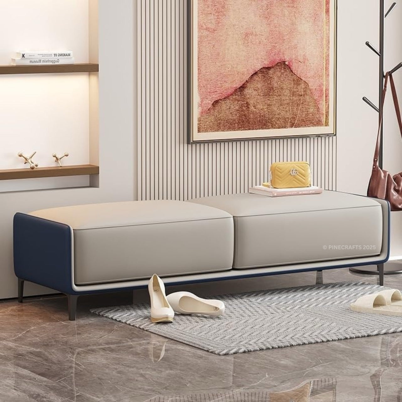 Modern gray sofa with blue armrests in a living room setting.